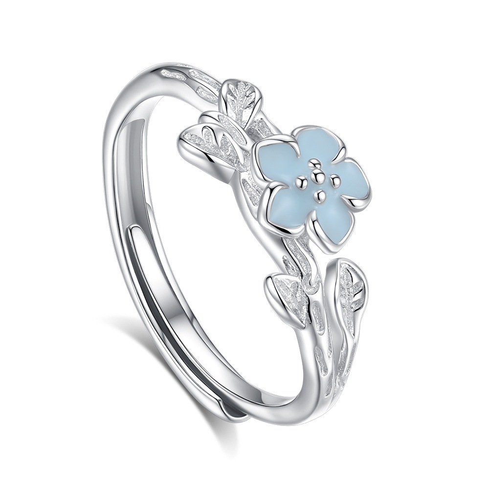 Women’s luminous sterling silver ring blooming softly in the dark