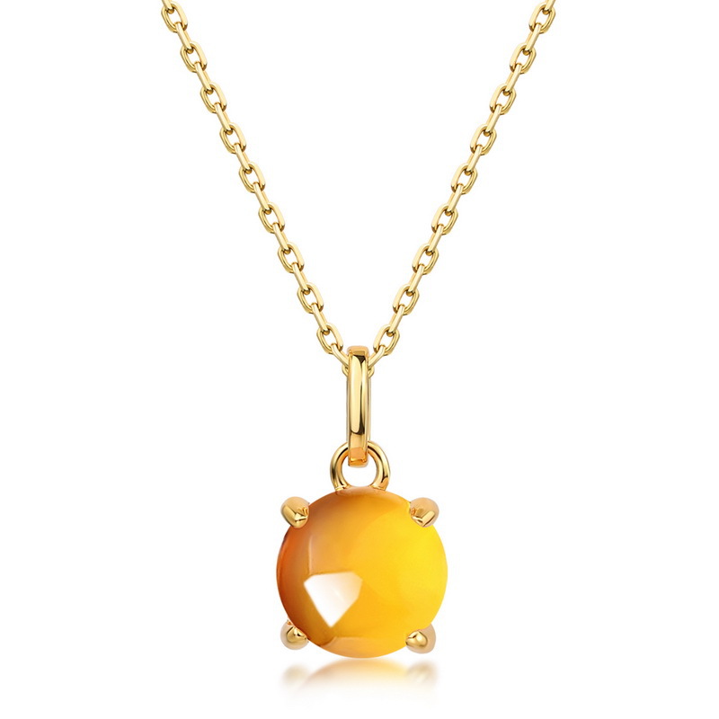 Vibrant yellow citrine cabochon pendant in gold bezel