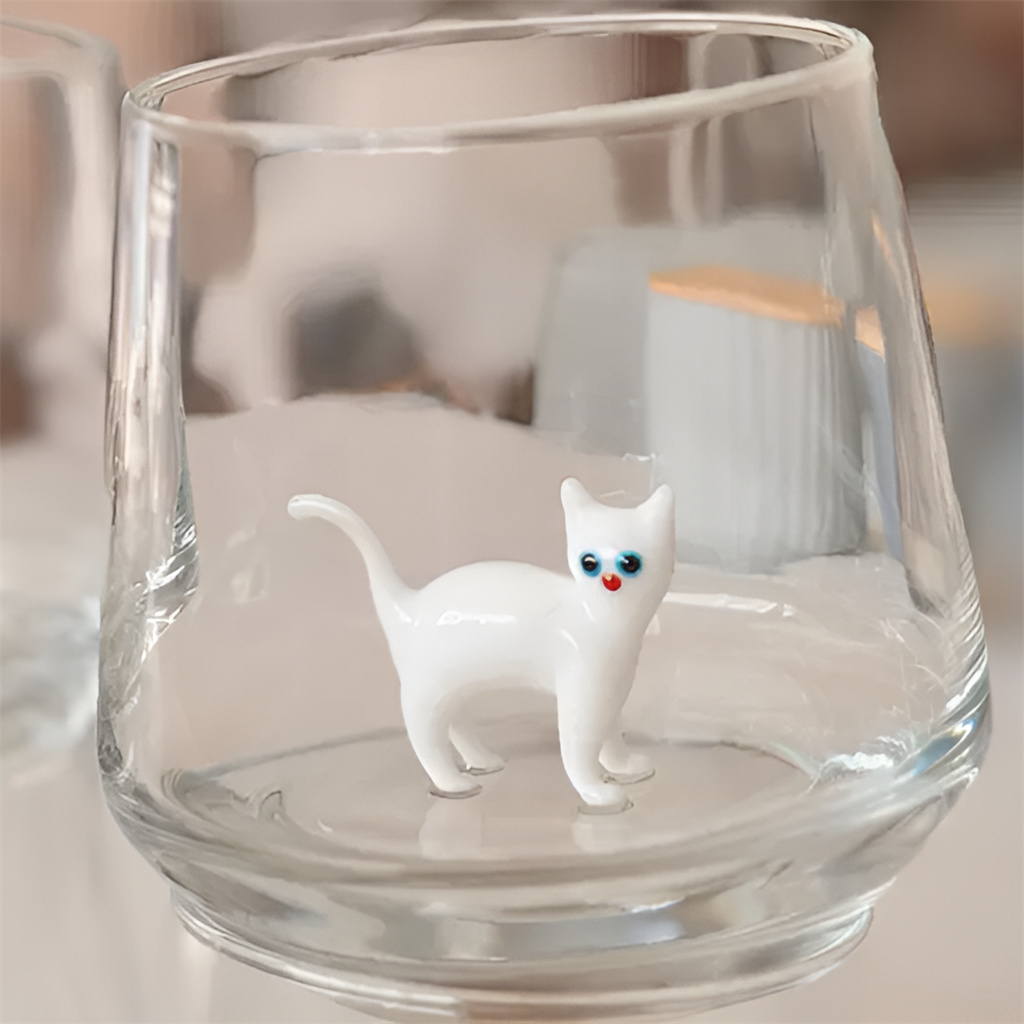 Drinking Glass with Cat Figurine