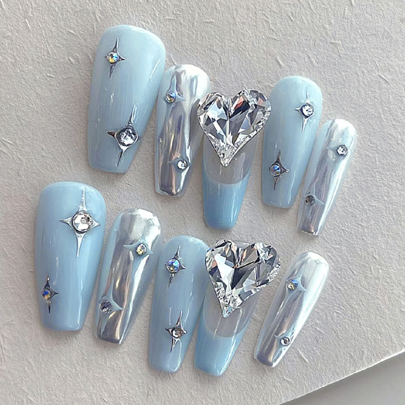 Mid length ballet style sky blue star nail enhancement with giant sparkle heart silver metallic feel wearing armor Z752