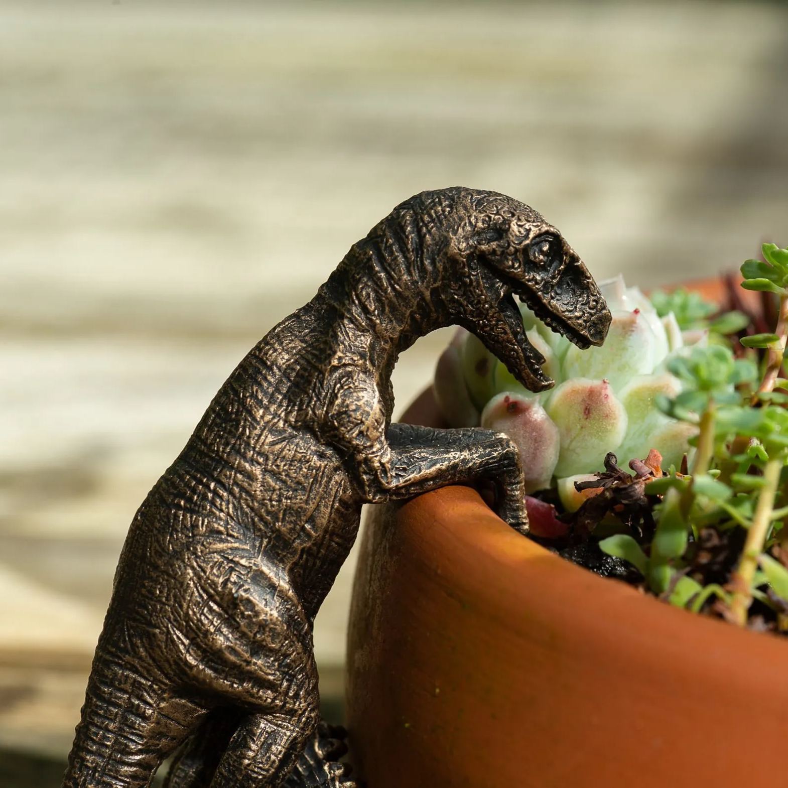 Bronze Velociraptor Pot Buddy