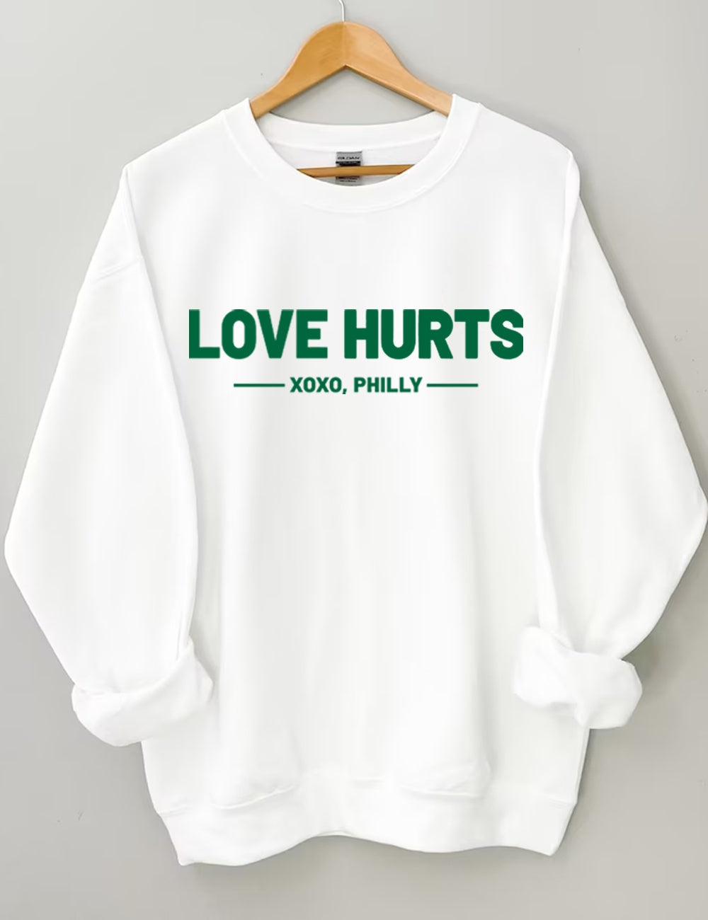 Love Hurts No One Like Us We Don't Care Eagles Football Sweatshirt