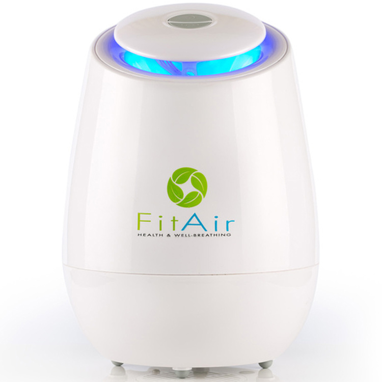 FitAir compact air purifier with blue indicator light, designed to clean indoor air, reduce allergens, remove odours and support a healthier home environment.