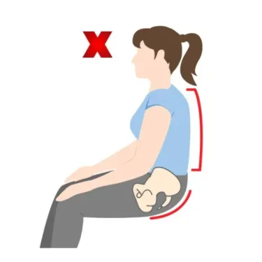 Illustration showing incorrect sitting posture with a slouched spine and tilted pelvis, highlighting poor alignment that can increase lower back strain and discomfort when sitting without proper support.