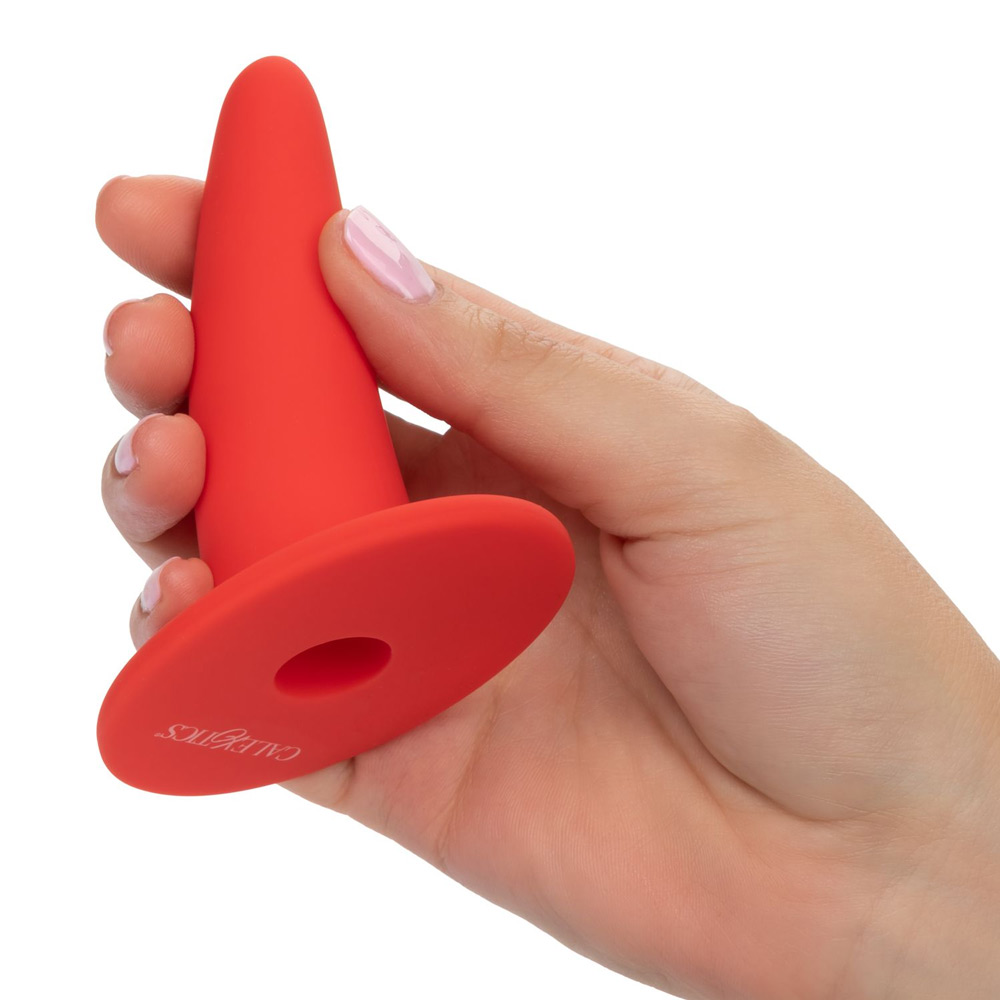 She-Ology silicone vaginal dilator held in hand, wearable dilator for vaginismus and vaginal stenosis therapy