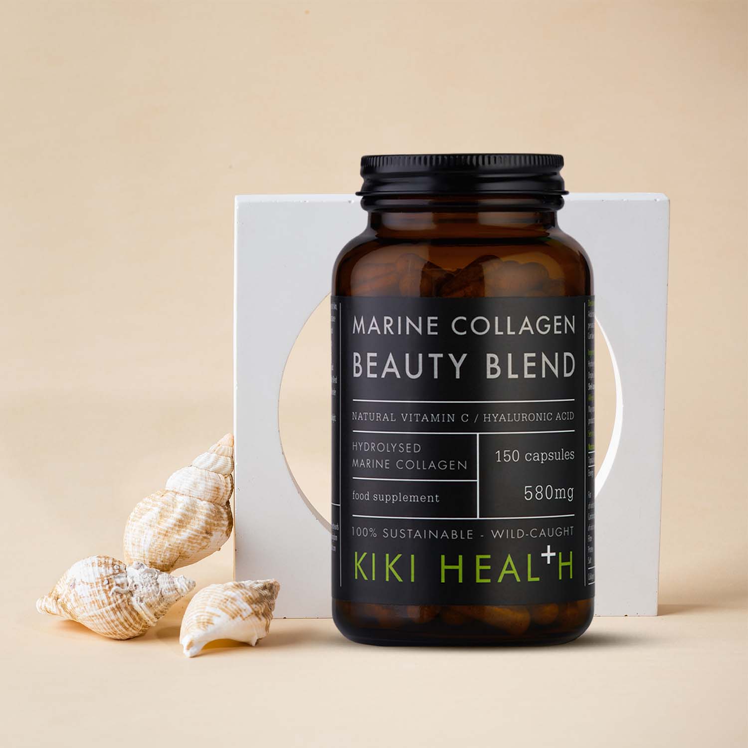 KIKI Health Beauty Blend Marine Collagen capsules bottle displayed with seashells and minimalist backdrop, highlighting sustainably sourced wild marine collagen supplement with vitamin C and hyaluronic acid, designed to support skin hydration, elasticity, and natural beauty.