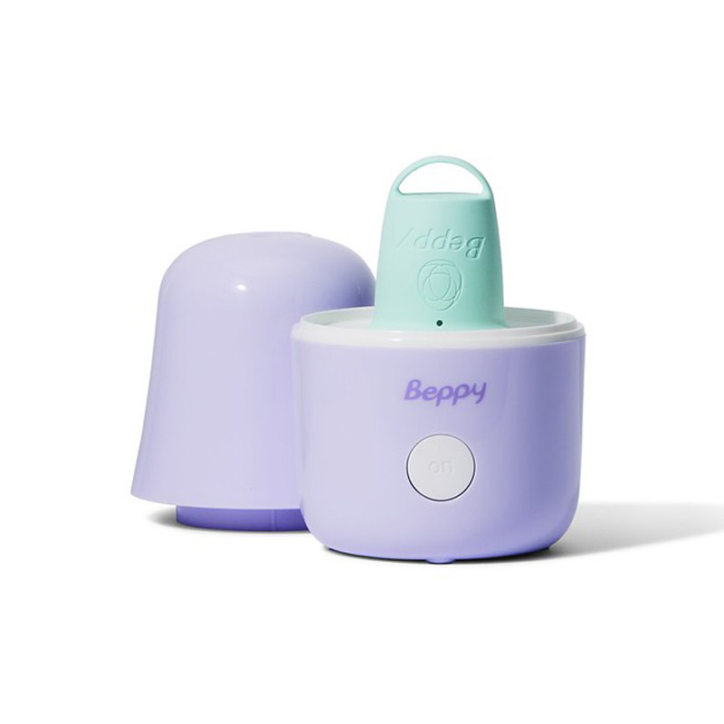 Beppy menstrual cup steam sterilizer with lid removed showing menstrual cup inside, compact lavender sterilising device with one-touch operation, designed to clean and disinfect menstrual cups using water and steam for safe, hygienic period care.