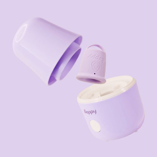 Exploded view of the Beppy menstrual cup sterilizer showing the lid, removable cup holder, and base unit, illustrating the compact steam sterilisation design for safe, hygienic menstrual cup cleaning.