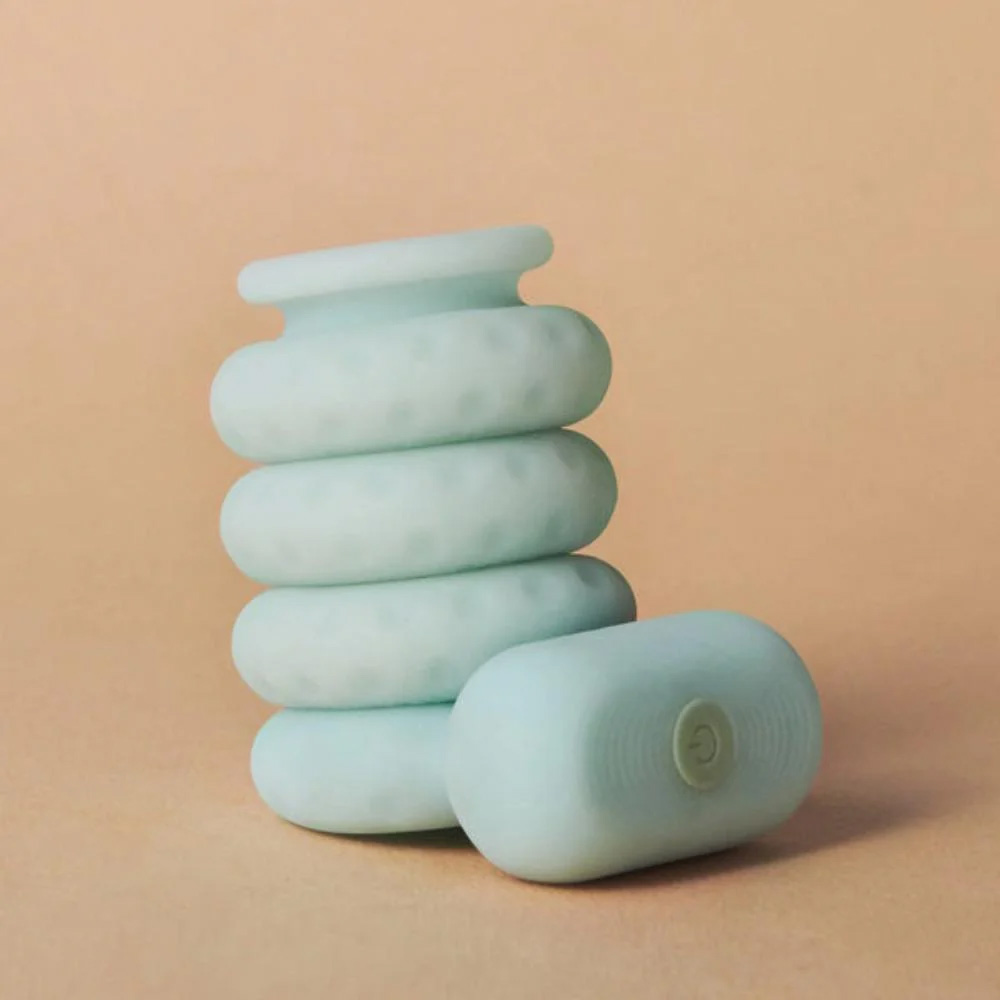 Ohnut Vibrating Ring shown in soft, body-safe silicone, designed for comfort and pleasure. Features gentle vibration, flexible cushioning, and can be used alone or with Ohnut buffer rings to support relaxed, pain-aware intimacy.