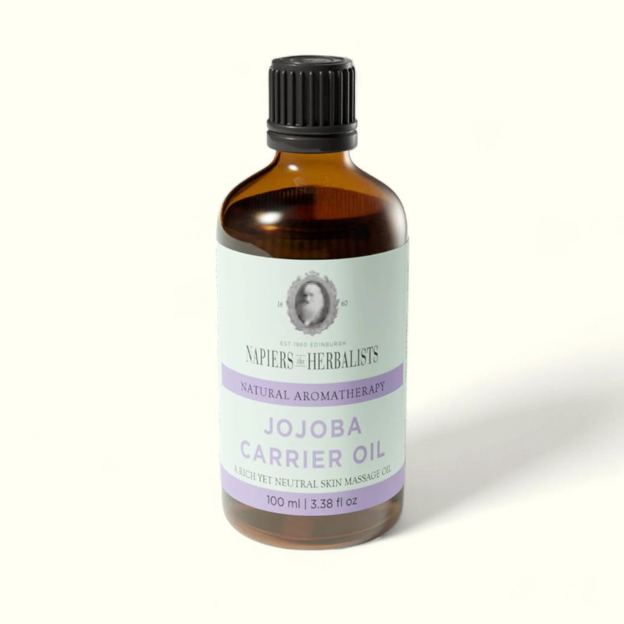 Napiers Jojoba Carrier Oil bottle on a light background, a pure cold-pressed jojoba oil used as a versatile carrier oil for skincare, massage and hair care, suitable for all skin types and formulated by Napiers Herbalists.