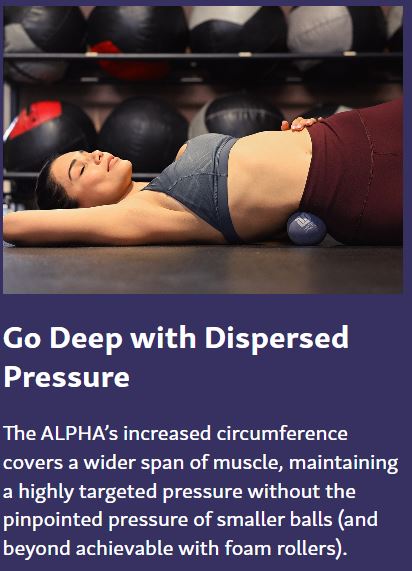 In-use image showing the Alpha Ball positioned under the lower back to provide deep, dispersed pressure for muscle release and recovery.
