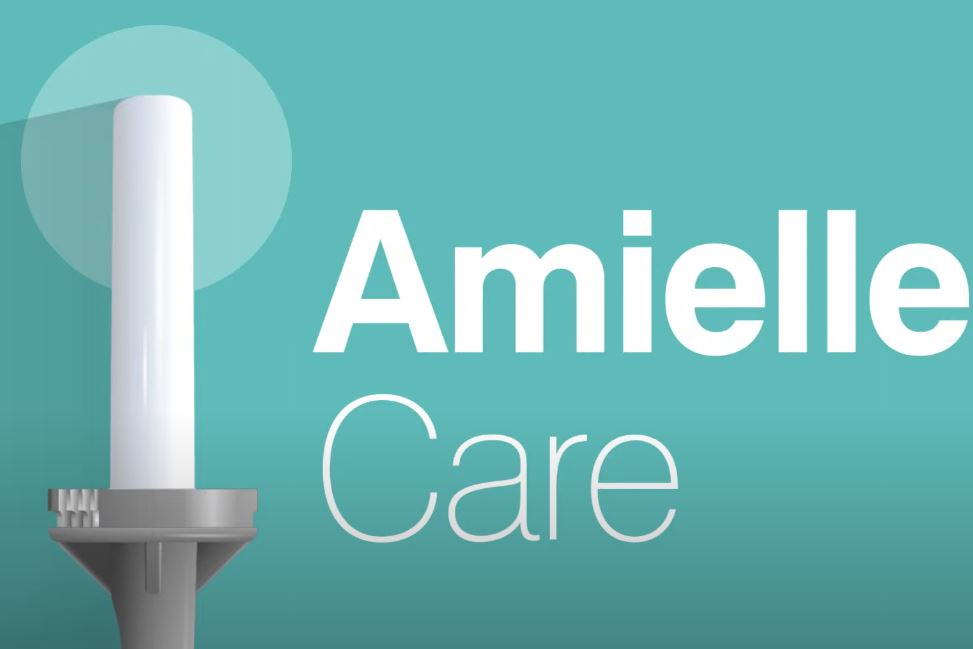 Amielle Care medical dilator with grey twist-and-lock handle, shown on a teal background, designed for pelvic floor therapy, vaginal dilation, and post-treatment rehabilitation support.