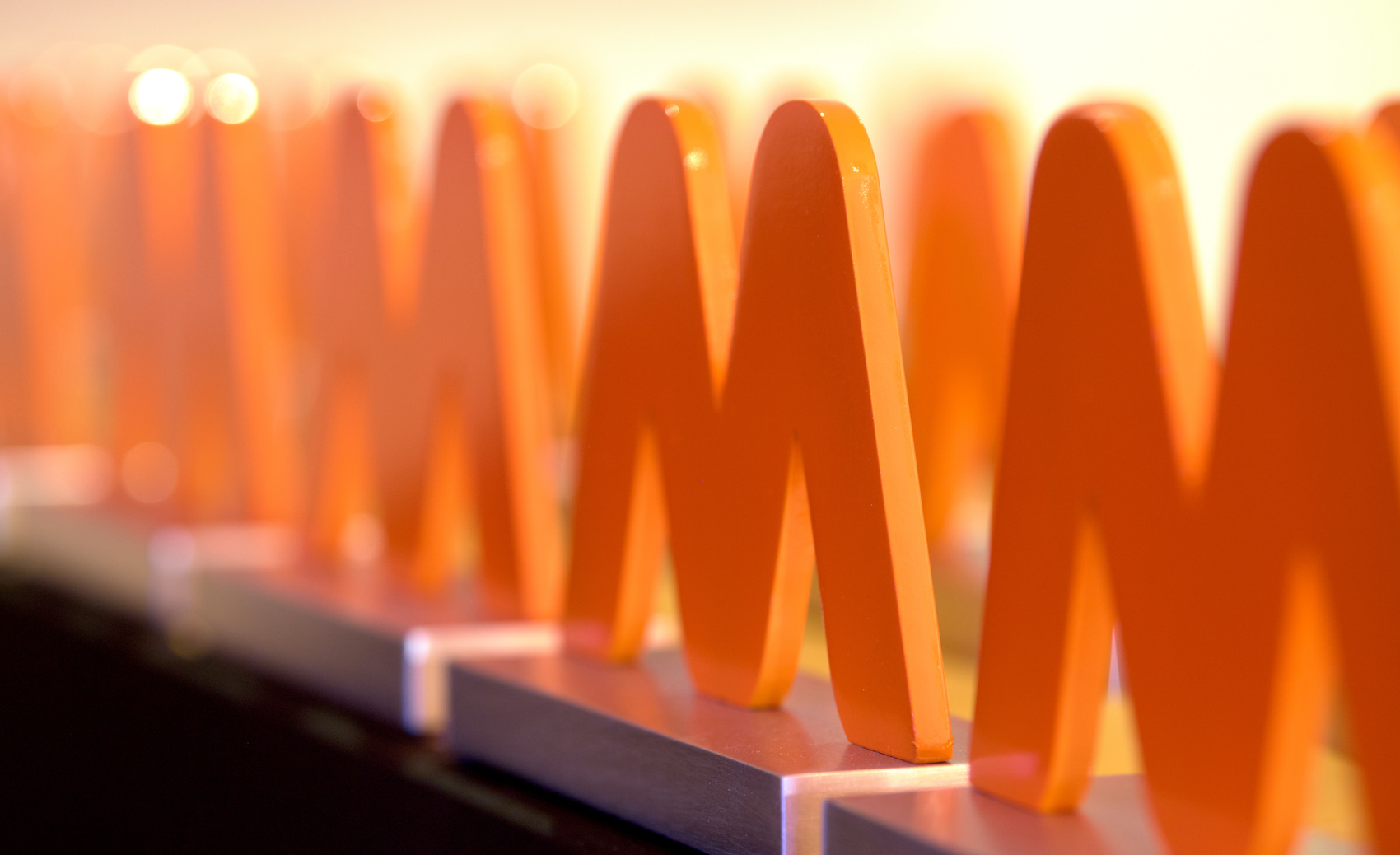 National Success for Savantini at the Medilink Healthcare Business Awards!-StressNoMore. Row of orange Medilink Healthcare Business Awards trophies, representing Savantini’s success and recognition in the healthcare industry.