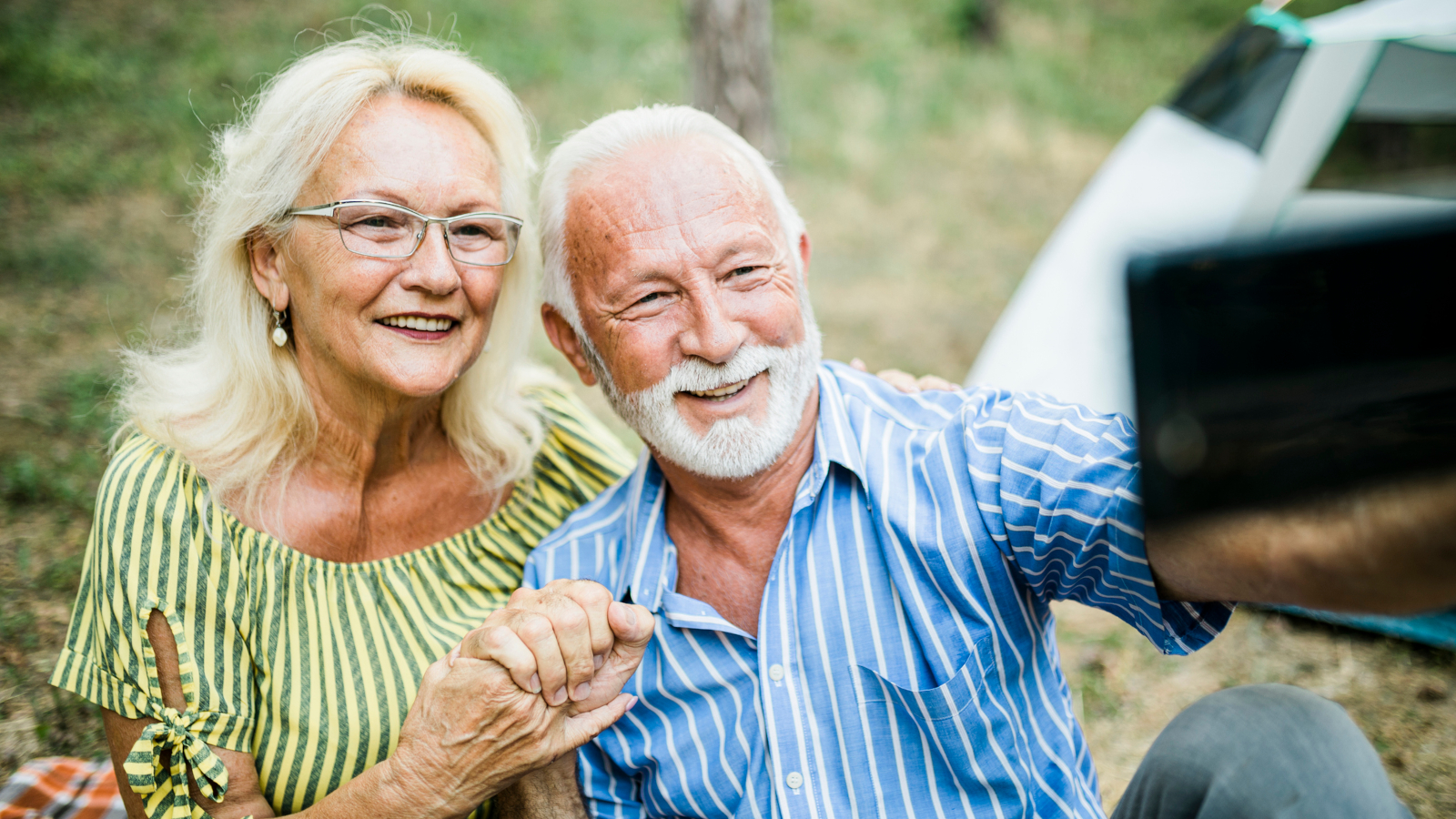 Are You Looking To Find Relief From Arthritis? StressNoMore Can Help...-StressNoMore. Happy older couple taking a selfie outdoors, symbolising healthy ageing, strong relationships, wellbeing and enjoying an active lifestyle together.