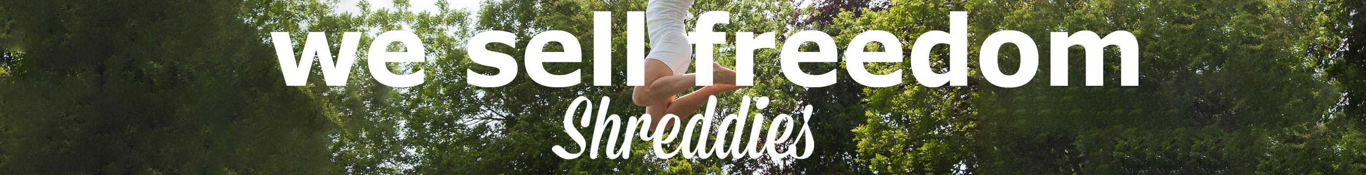 Shreddies flatulence-filtering clothing banner featuring we sell freedom slogan and a person leaping in a green outdoor setting