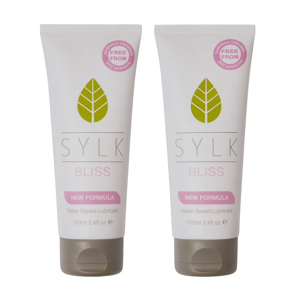 Two SYLK BLISS natural water-based lubricant tubes shown side by side on a white background, featuring the new formula, plant-based intimate lubricant that is pH balanced, gentle, and designed to support comfortable, everyday intimate hydration.
