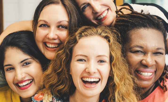 Your Pelvic Floor- All the Basics You Need to Know-StressNoMore. Group of diverse women smiling together, representing female health, empowerment and awareness of pelvic floor wellbeing.