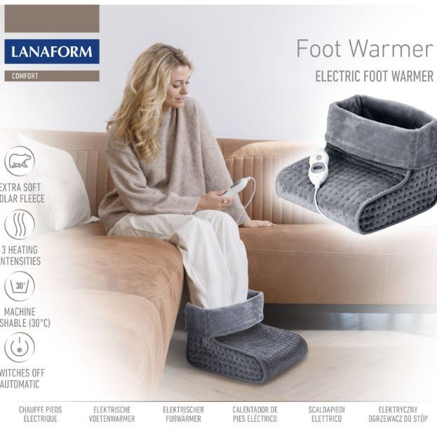 Lanaform electric foot warmer in use on a sofa, featuring extra-soft polar fleece, three heat settings, washable lining, and automatic shut-off, designed to warm cold feet, improve comfort, and support circulation at home.