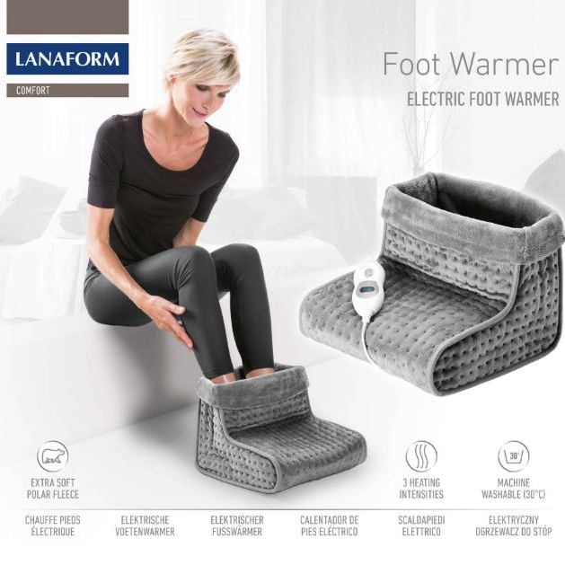 Lanaform electric foot warmer in use on a sofa, featuring extra-soft polar fleece, three heat settings, washable lining, and automatic shut-off, designed to warm cold feet, improve comfort, and support circulation at home.
