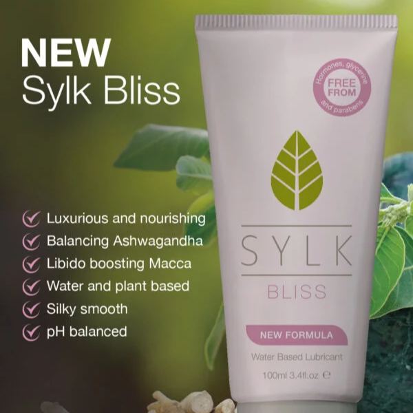 SYLK BLISS natural water-based lubricant tube shown with plant imagery and feature list, highlighting new formula that is water and plant based, pH balanced, silky smooth, nourishing, and infused with ashwagandha and maca to support intimate comfort.