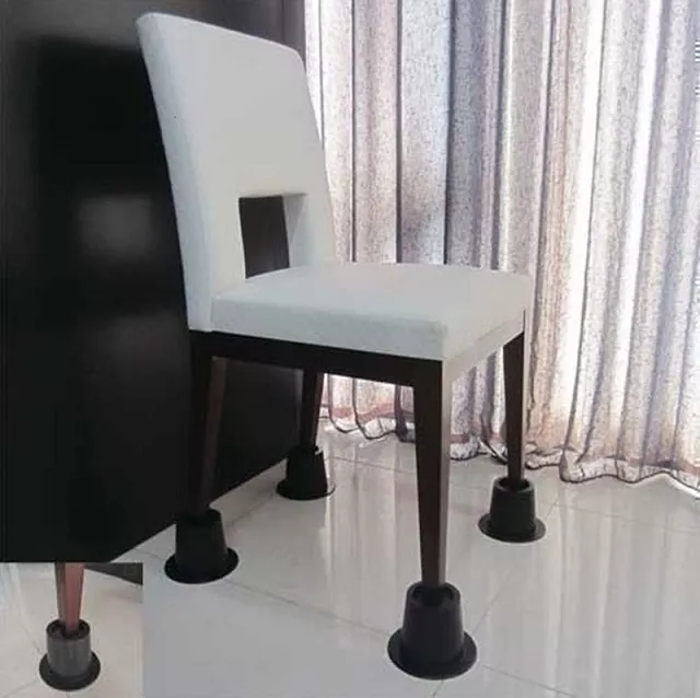 Osalis Home Help Set of 4 Chair Raisers - Dining chair fitted with black chair raisers on each leg, increasing seat height to make sitting and standing easier for elderly or mobility-impaired users while improving stability and safety on tiled floors.