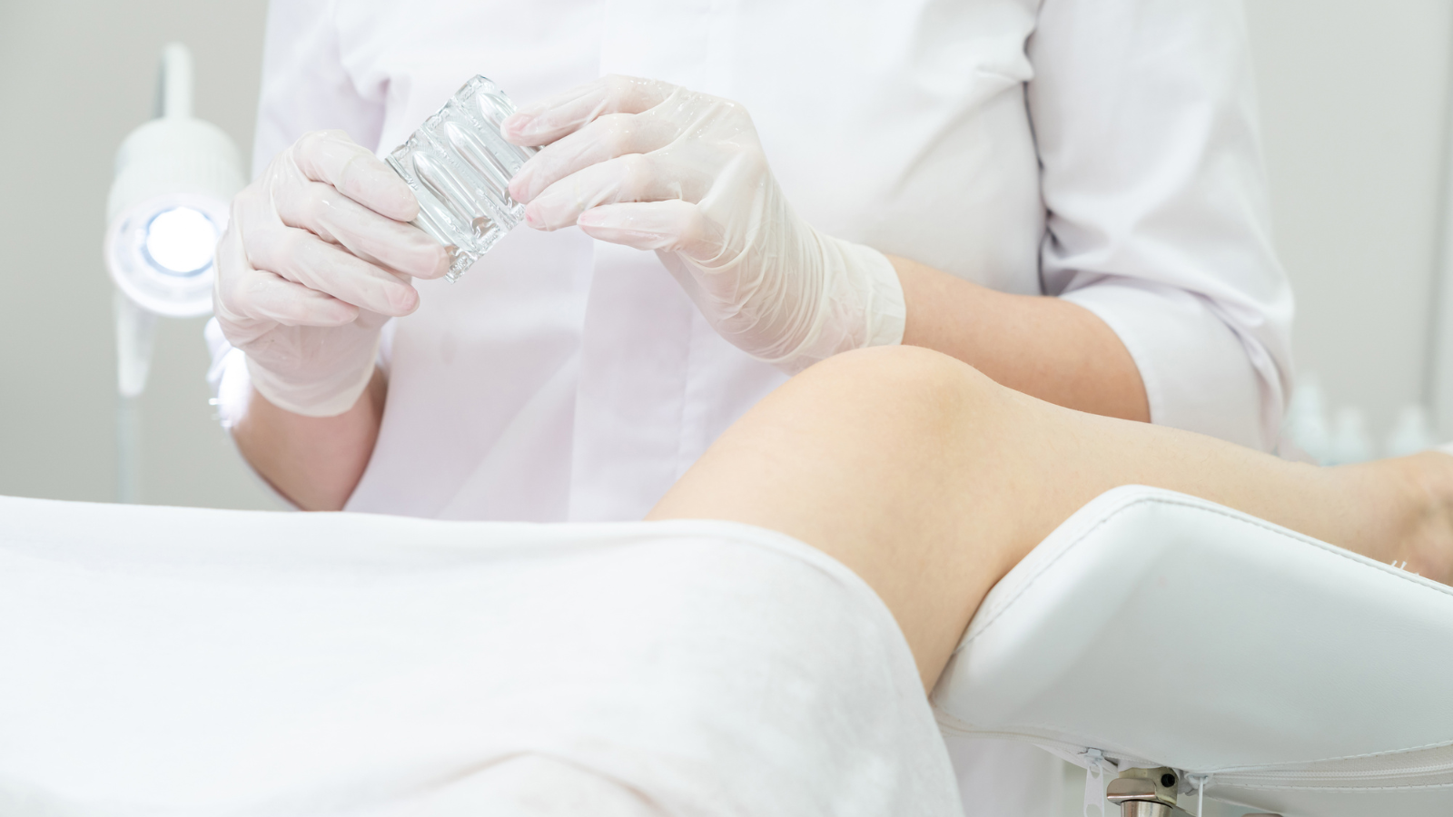 Clinician holding a medical device during a pelvic health appointment, used to support content discussing when a pessary may be needed for prolapse or support issues. Do You Need a Pessary?-StressNoMore