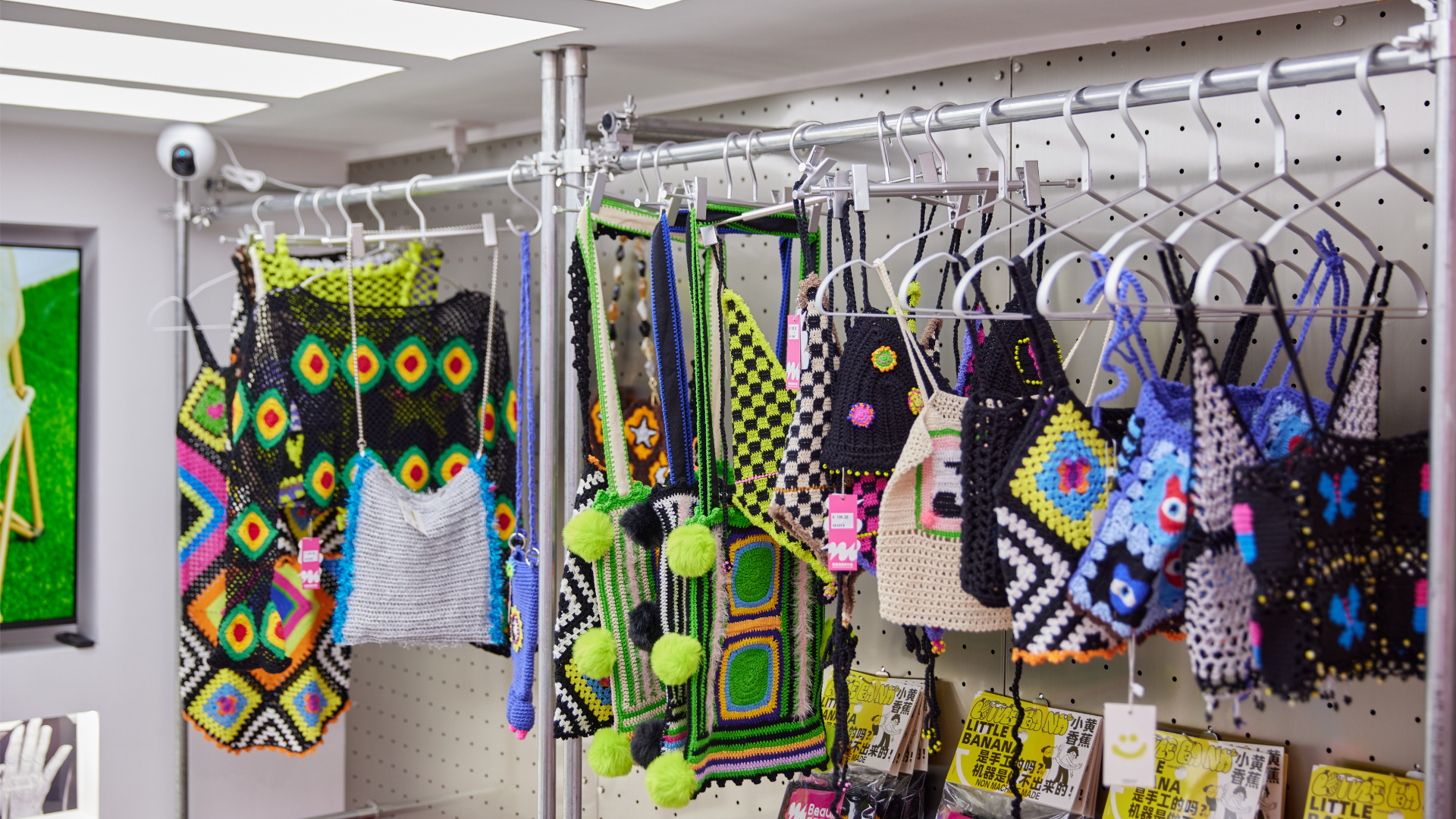 A colorful array of artisan-made crochet pieces on display, representing FeekyStore's curated selection of fairycore and aesthetic fashion accessories.
