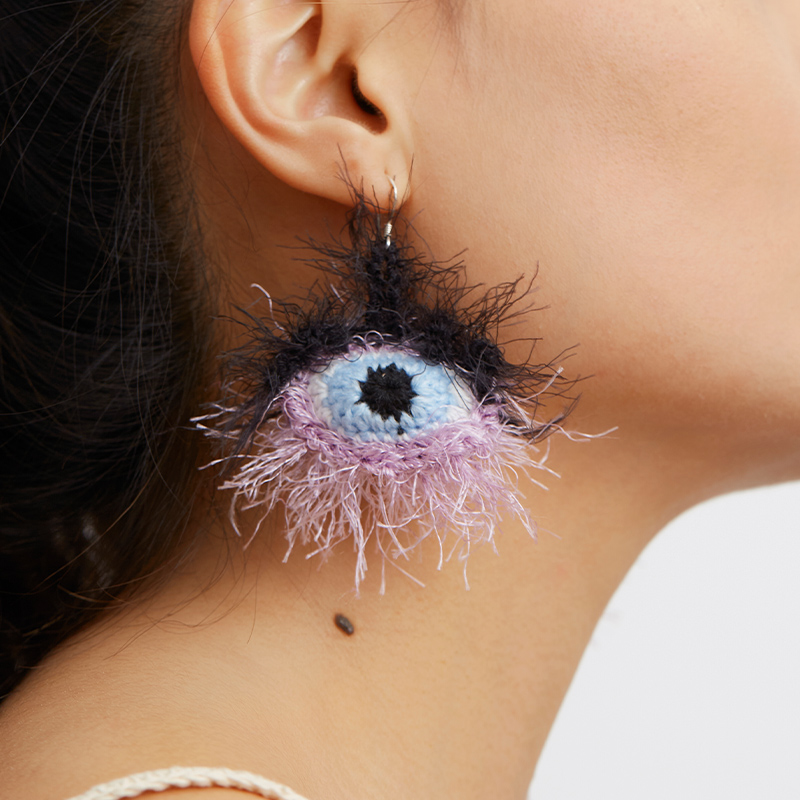 Purple furry eye earrings