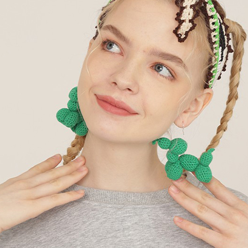 Green dog earrings