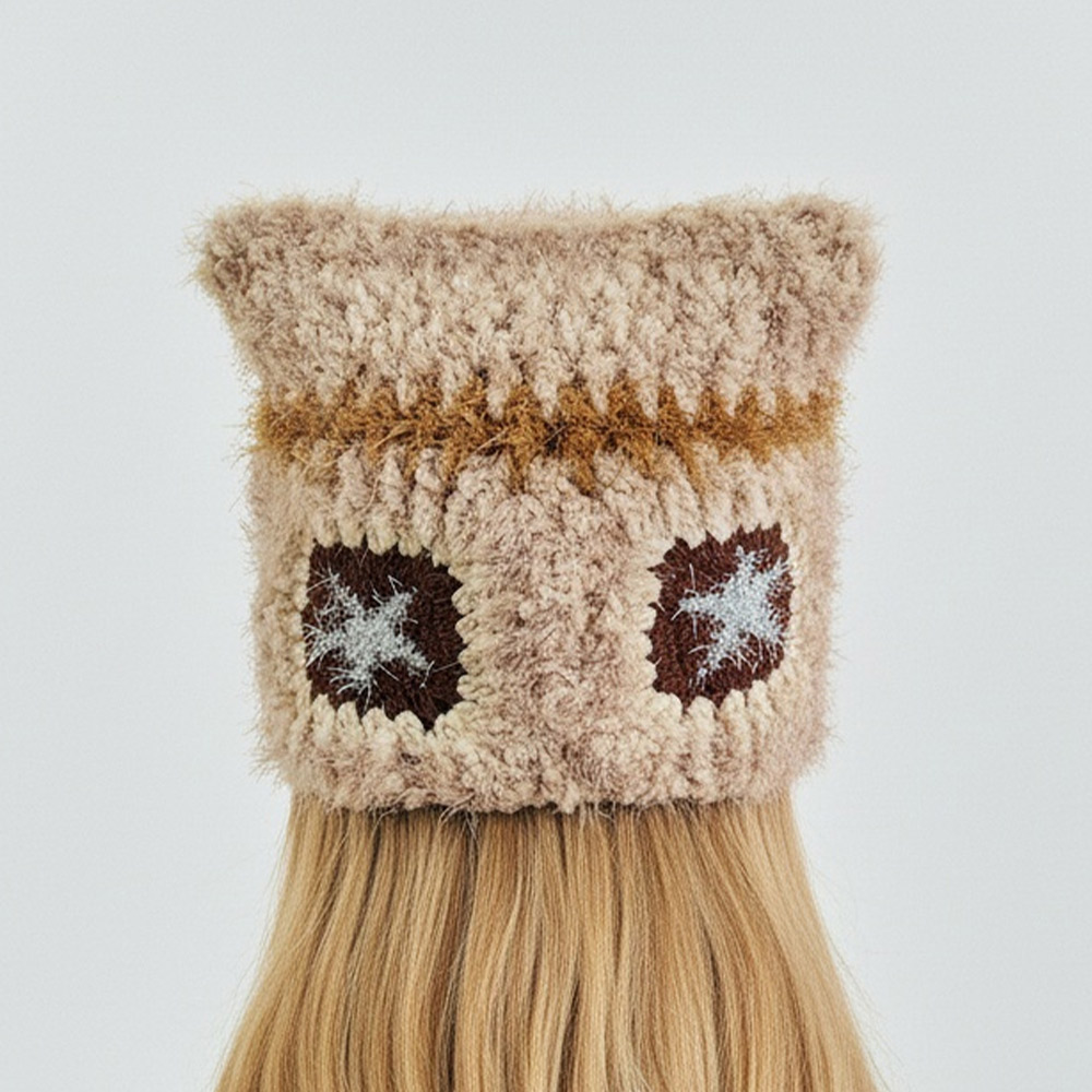 Back view of the fluffy Cat Star Crochet Hat, showcasing two dark brown square patches with iconic star patterns on the fuzzy yarn design.