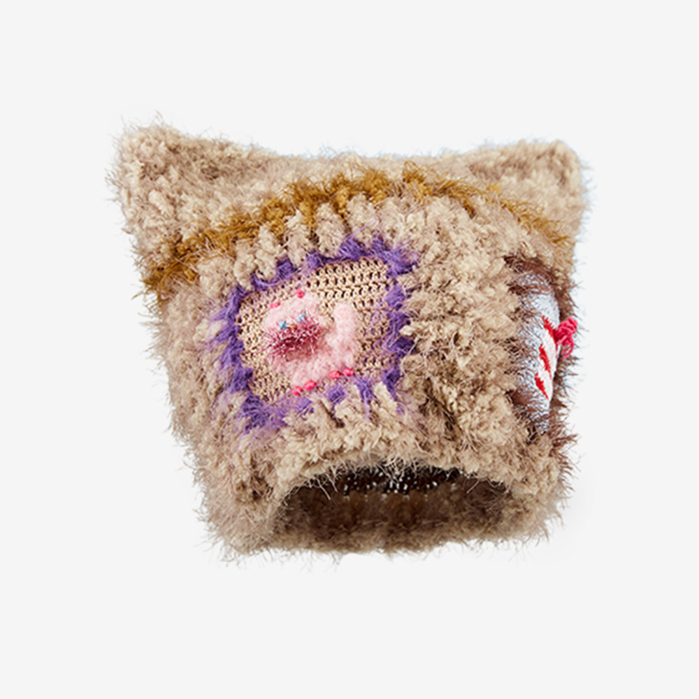 Isolated product view of the handmade Cat Star Crochet Hat against a clean background, displaying the full textured crochet look, cat ears, and colorful patch details.