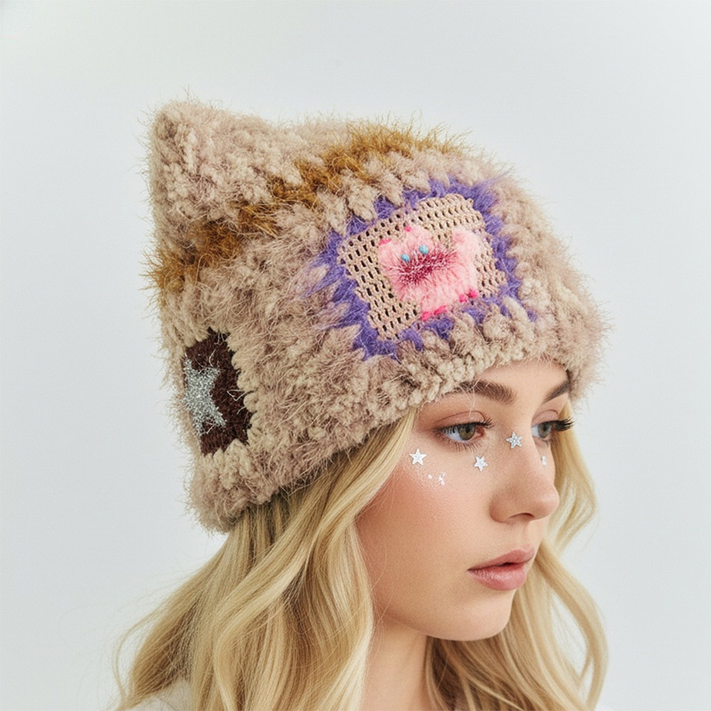 Side view of a blonde model wearing the fuzzy Cat Star Crochet Hat, highlighting a colorful granny square patch and playful cat ears.