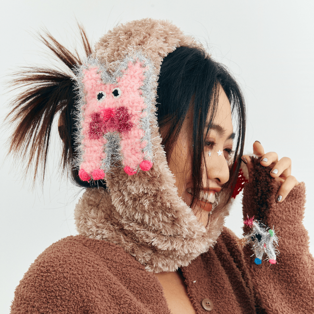 FeekyStore fluffy cat star scarf wrapped around a model's neck in a studio setting, side profile focusing on the textured knit and pink cat patch.