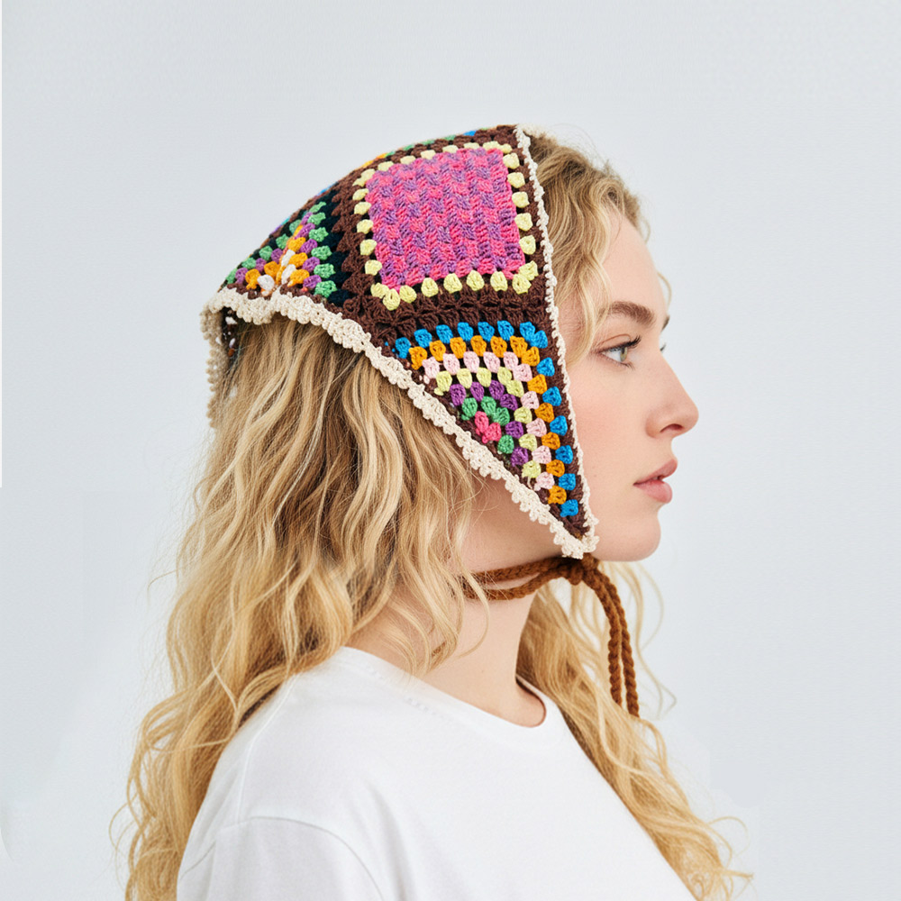 Detailed side profile shot of the colorful triangle crochet bandana, illustrating the perfect fit over long wavy hair.