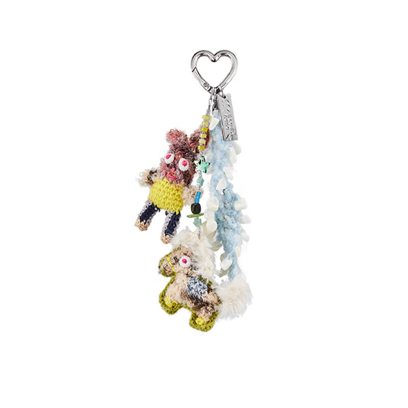 A high-resolution product shot of the Feeky crochet Bunny & Pony keychain on a white background, showcasing the full charm and heart-shaped clasp.