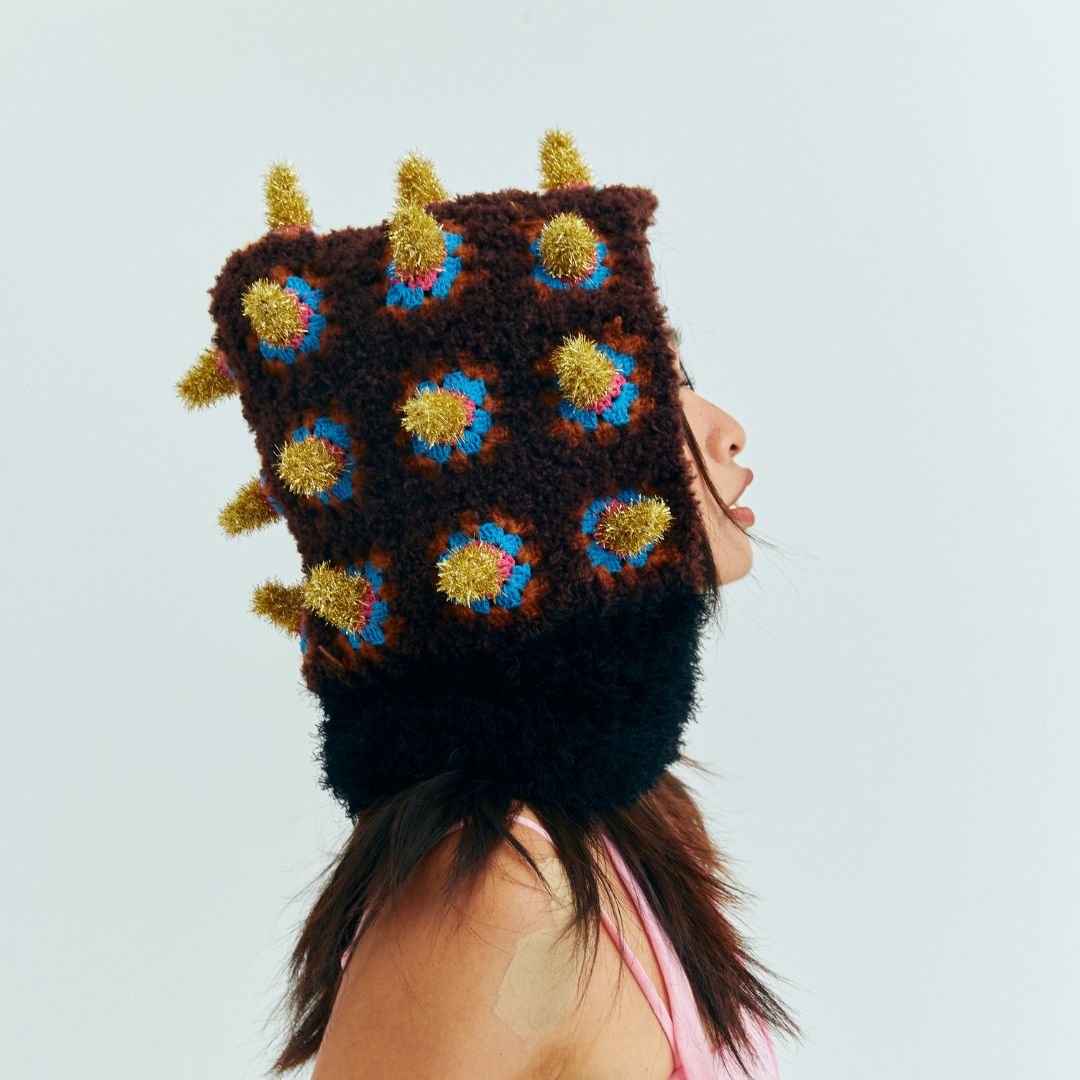 Side profile of the artisan-crocheted Fortune Bomb hat