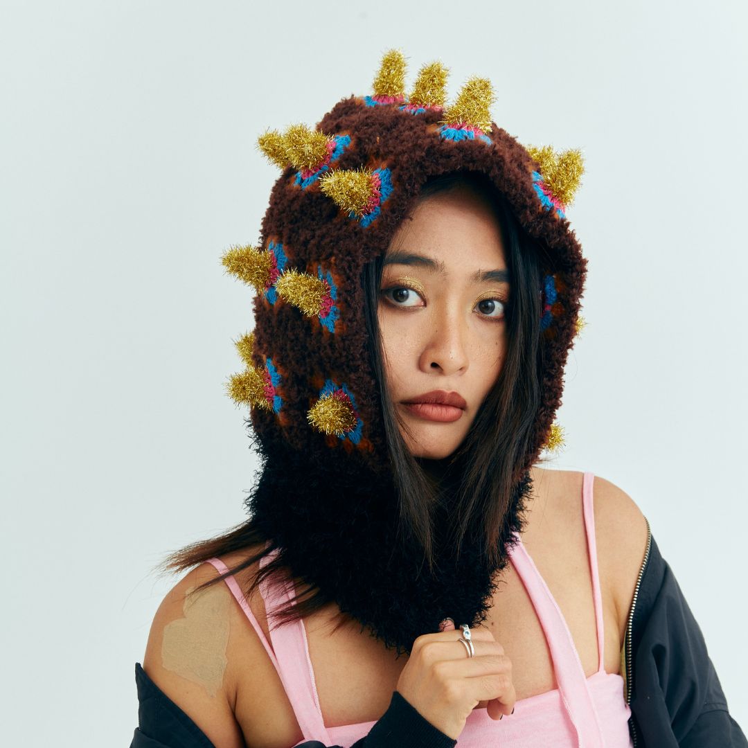 Close-up of the handcrafted Fortune Bomb star crochet hood
