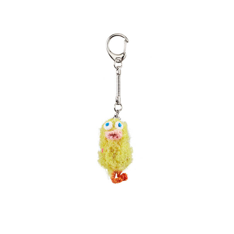 A perfectly centered product shot of the Feeky crochet Ugly Duckling keychain in Sun-baked Yellow against a pure white background.