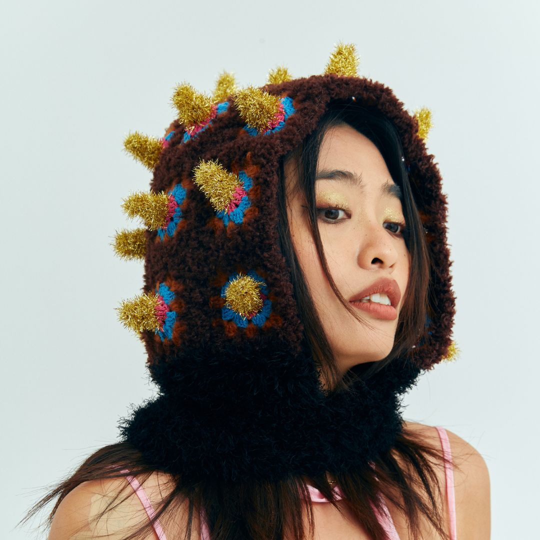 Model wearing the textured Fortune Bomb crochet hat