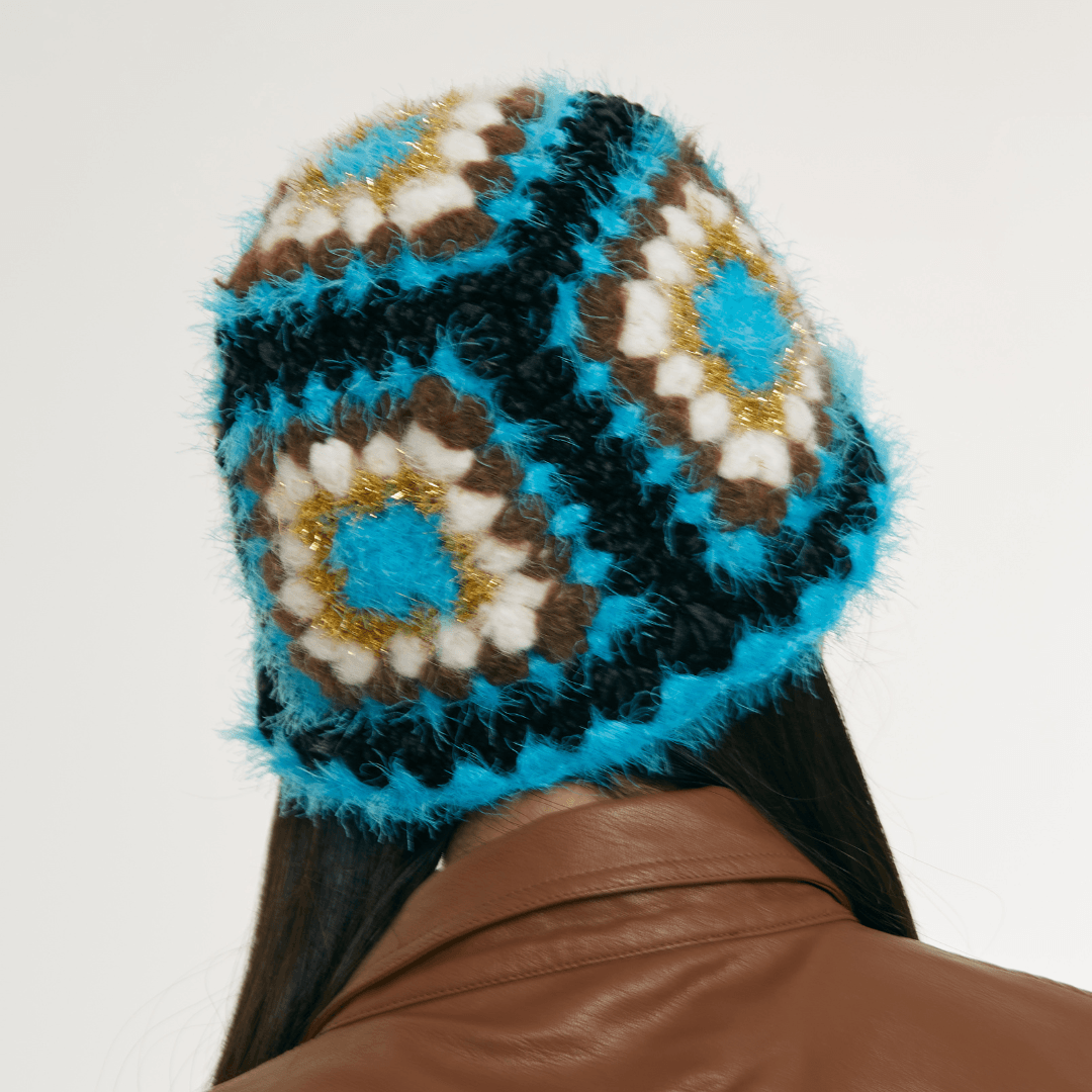 FeekyStore crochet Fisherman Hat showing a rear view of the blue and black geometric granny square pattern and crown construction in a clean studio setting.