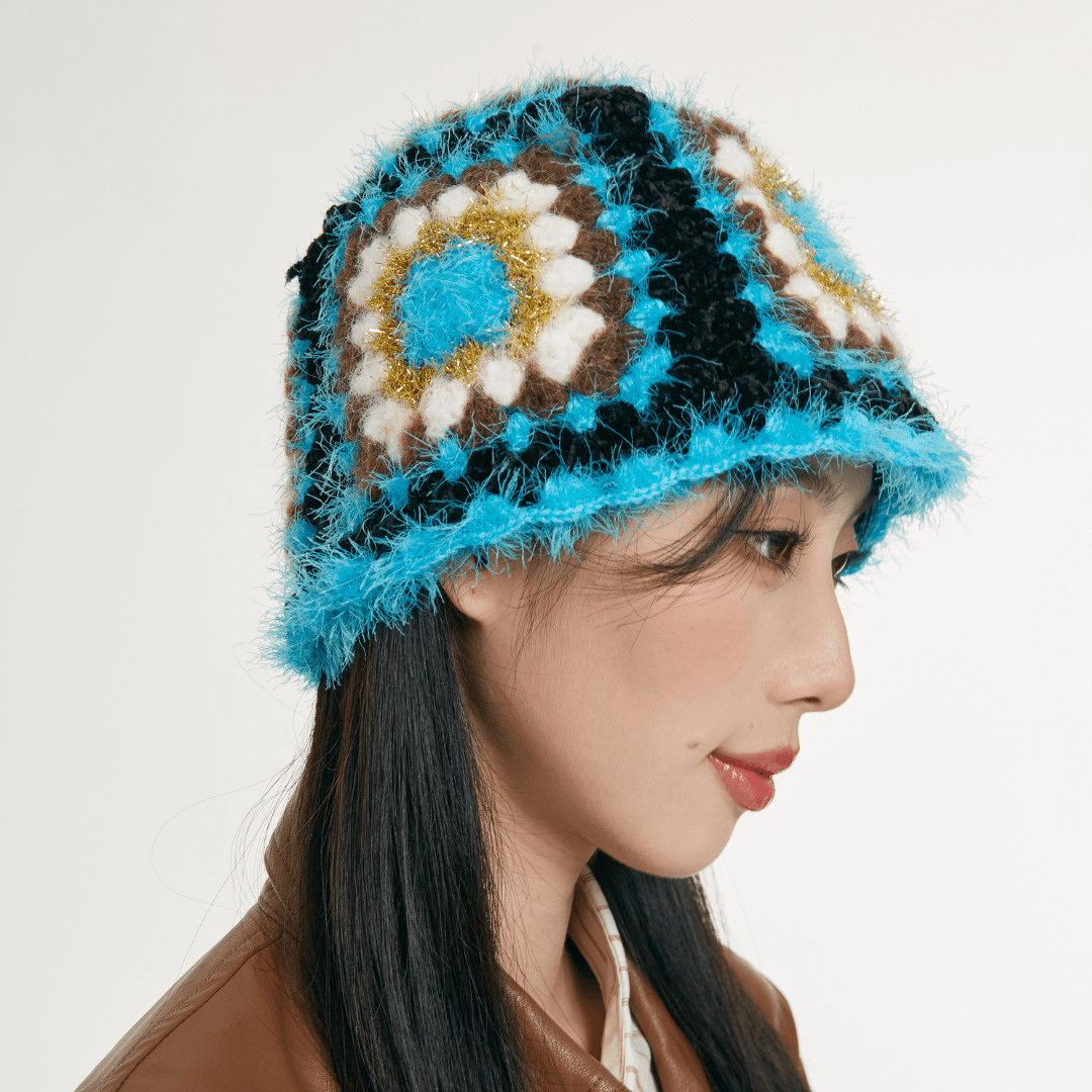 FeekyStore crochet Fisherman Hat showing a side profile of the blue and black geometric granny square pattern and textured brim in a clean studio setting.