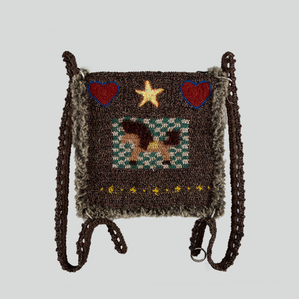Flat product view of the Heart Star Little Pony Crochet Backpack against a clean grey backdrop, clearly displaying the twin loop strap design.