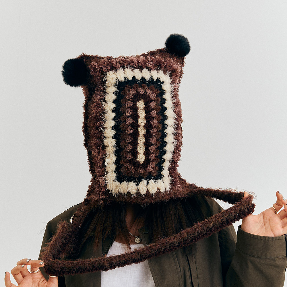 Detailed view of the multi-functional vintage grid crochet beanie hat with ears, showcasing the heavy-textured yarn work covering the face.