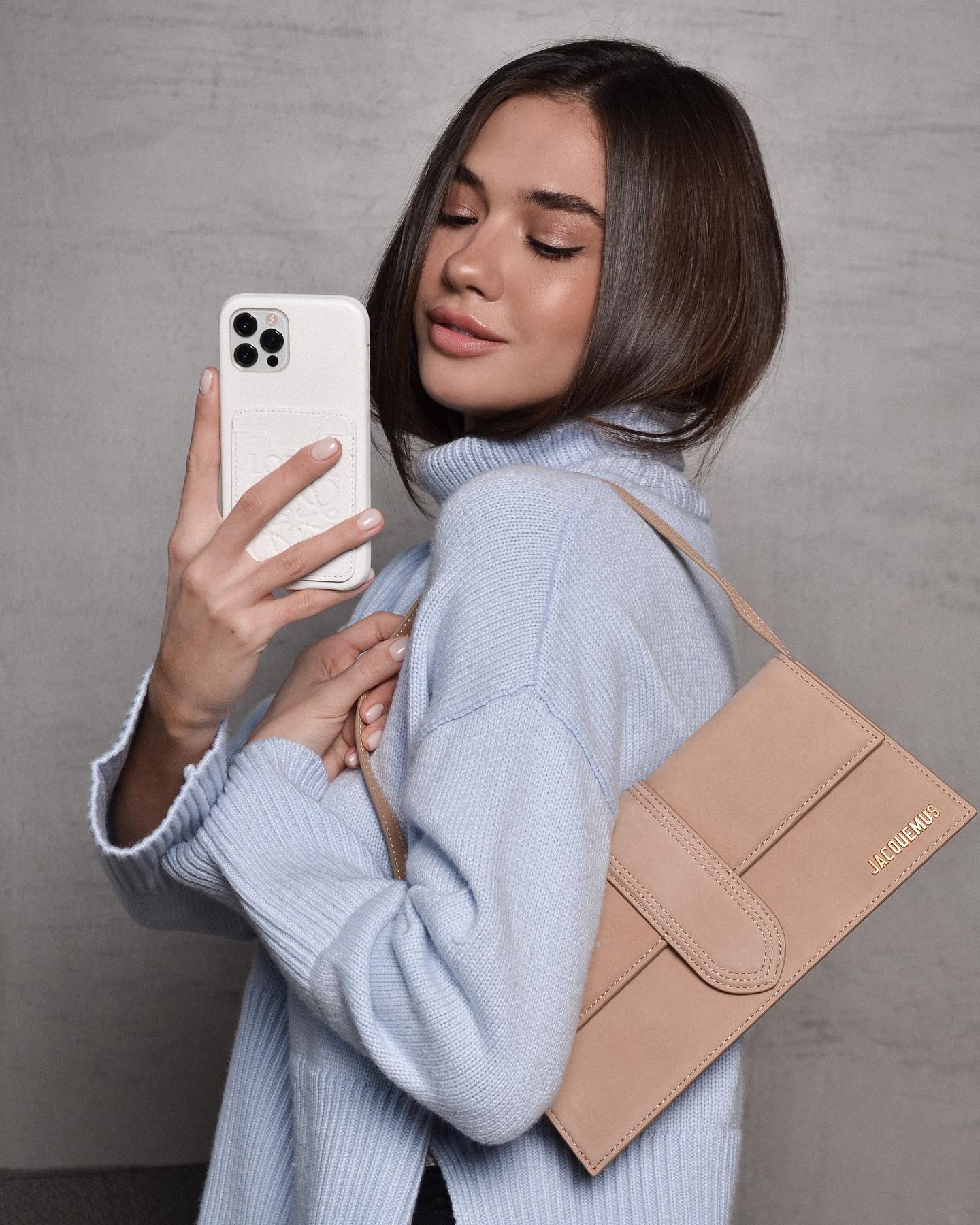 Collection of luxury iPhone cases in soft pastel shades like blush pink, sky blue, and mint green.