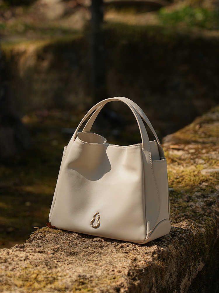 圓滿包頭層牛皮手拎菜籃子