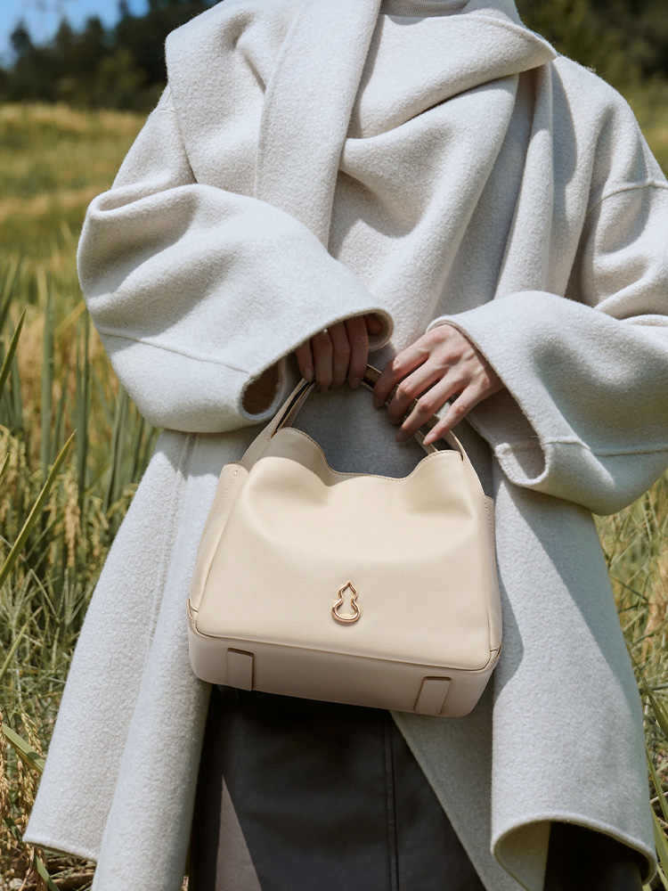 圓滿包頭層牛皮手拎菜籃子