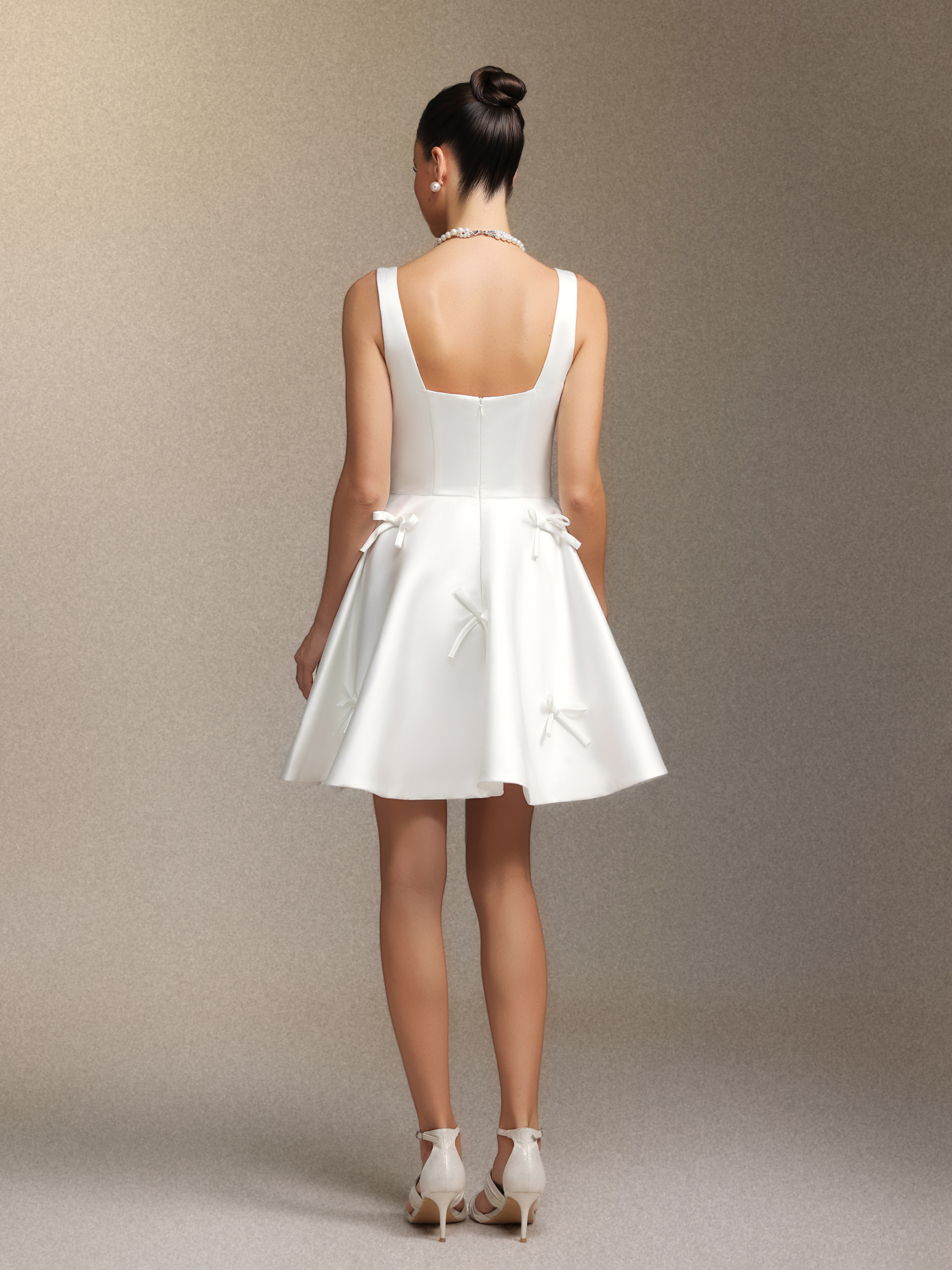 Sequoya Square-neck halter bow mini dress