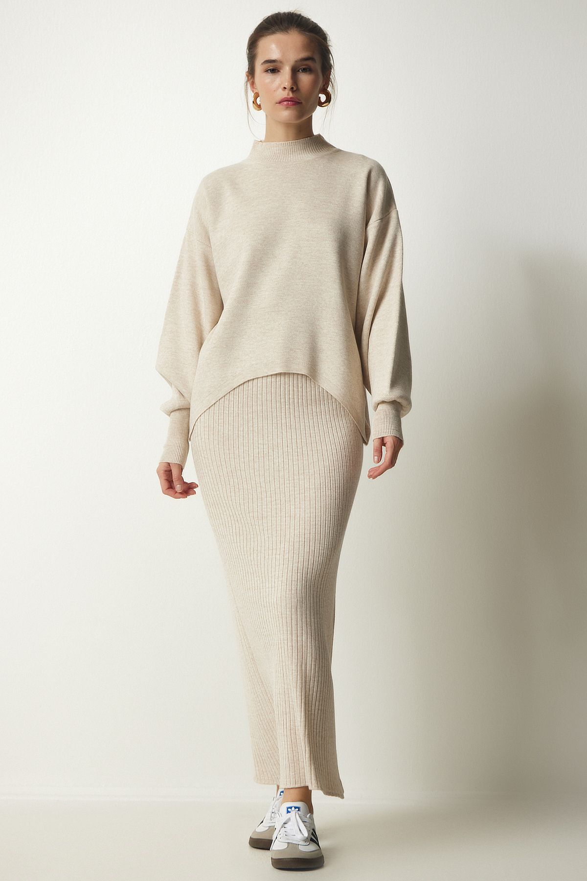 Woman in a ribbed knit midi skirt with a boxy sweater