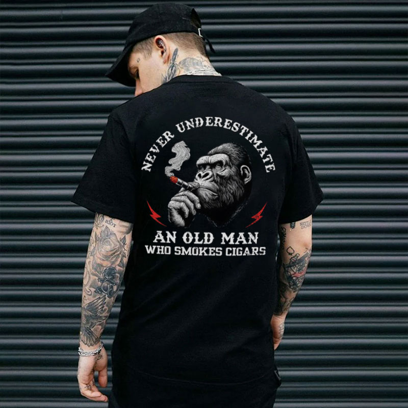 NEVER UNDERESTIMATE AN OLD MAN WHO SMOKES CICARS Chimpanzee Black Print T-shirt