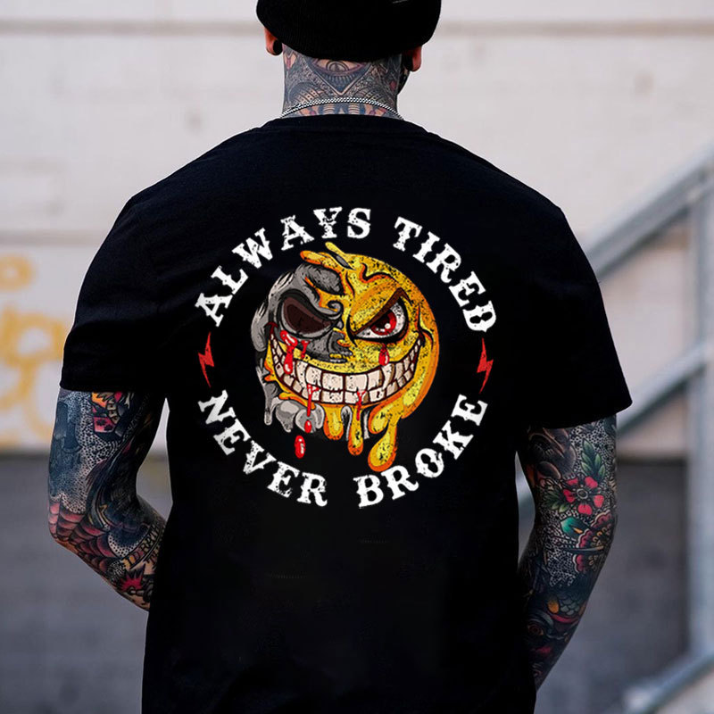 ALWAYS TIRED NEVER BROKE Melting Emoji Skull Black Print T-shirt